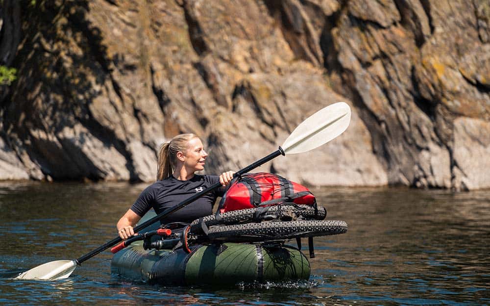 Packraft vs. Kayak: all the differences in a row | Packraft Travel 1 a woman in a raft with a paddle Kayak Packraft
