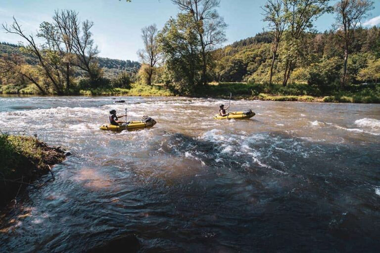 Packrafting in rapids.