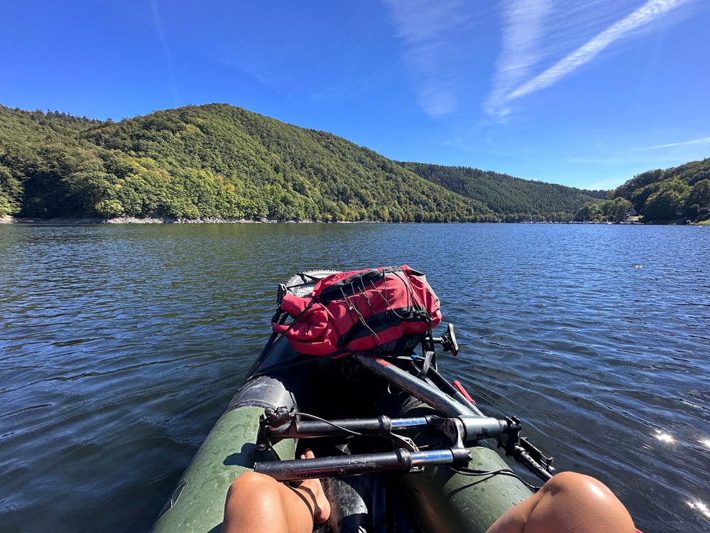 Packraft floating on the Rursee lake during a packrafting adventure